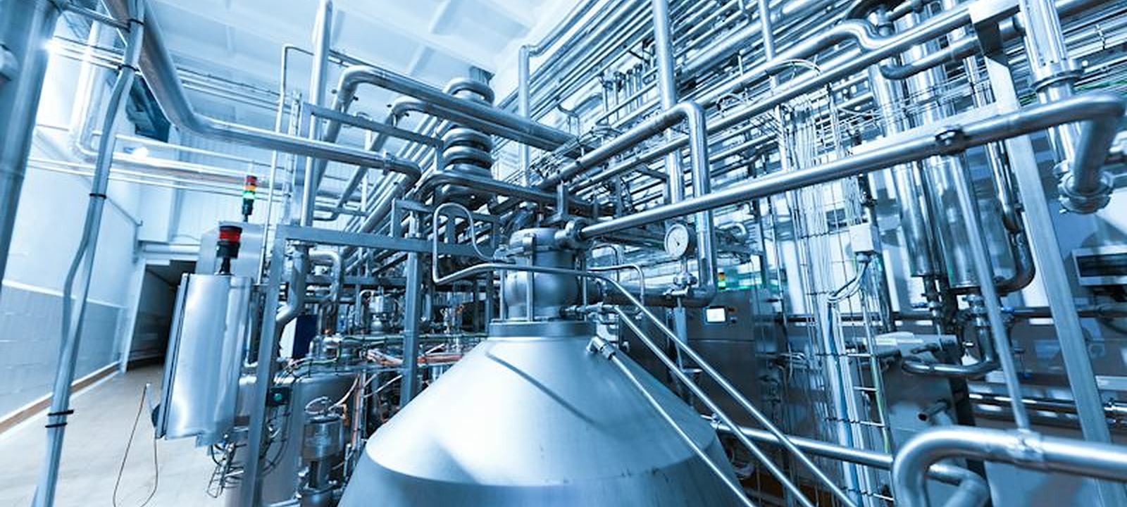 Stainless steel process vessel and piping inside an industrial plant