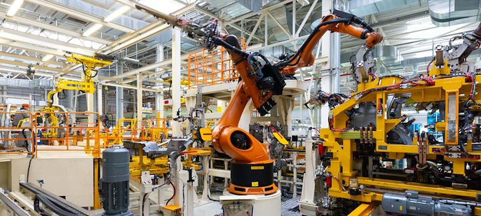 Robotic arms on an industrial manufacturing line