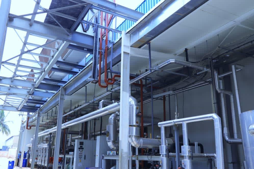 Insulated pipework and plant equipment beneath a steel structure at the Radisson Collection, Ikoyi