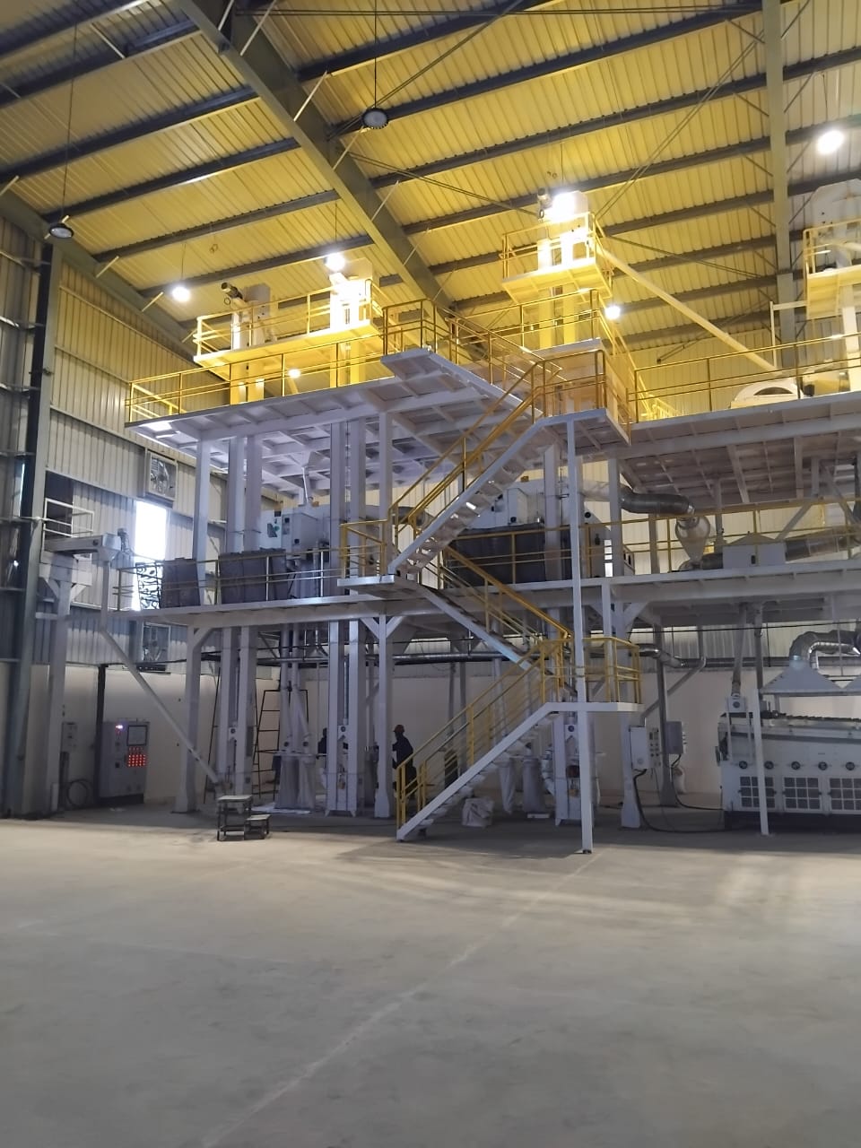 Interior of the production plant with multi-level steel platforms and staircases, Mozambique
