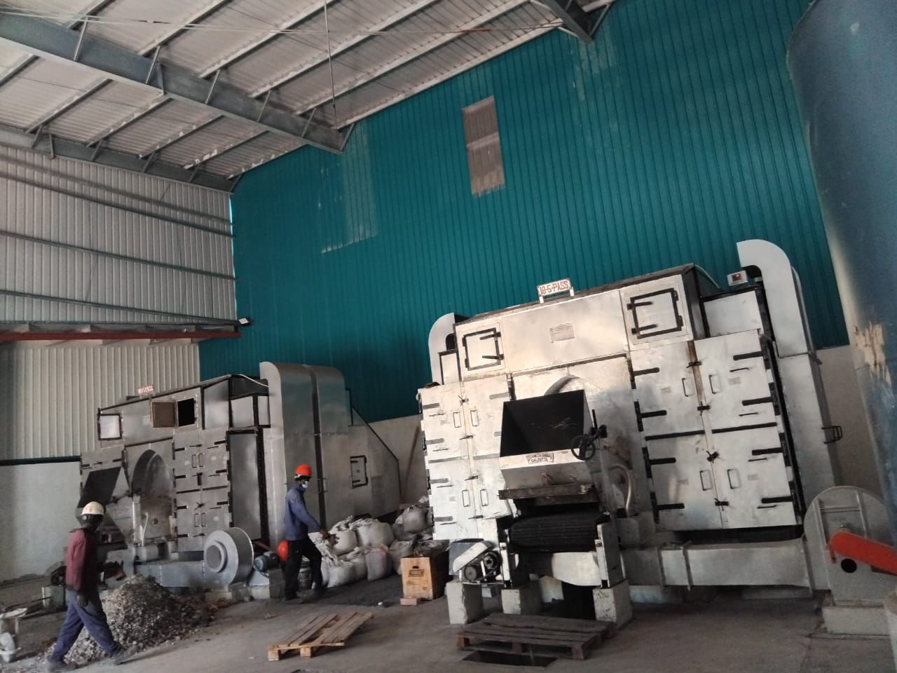 Hot air generator furnace units with technicians at work, Mozambique