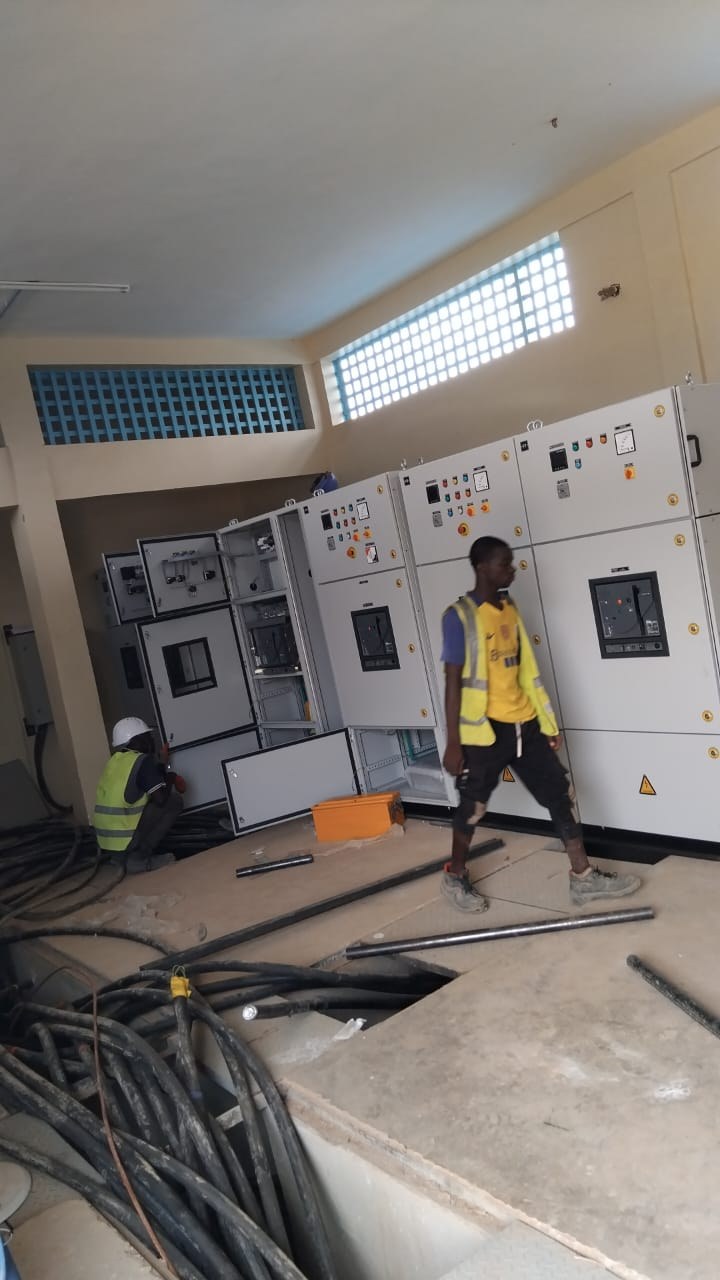 Switchgear room with LV panels being installed and wired, Burkina Faso